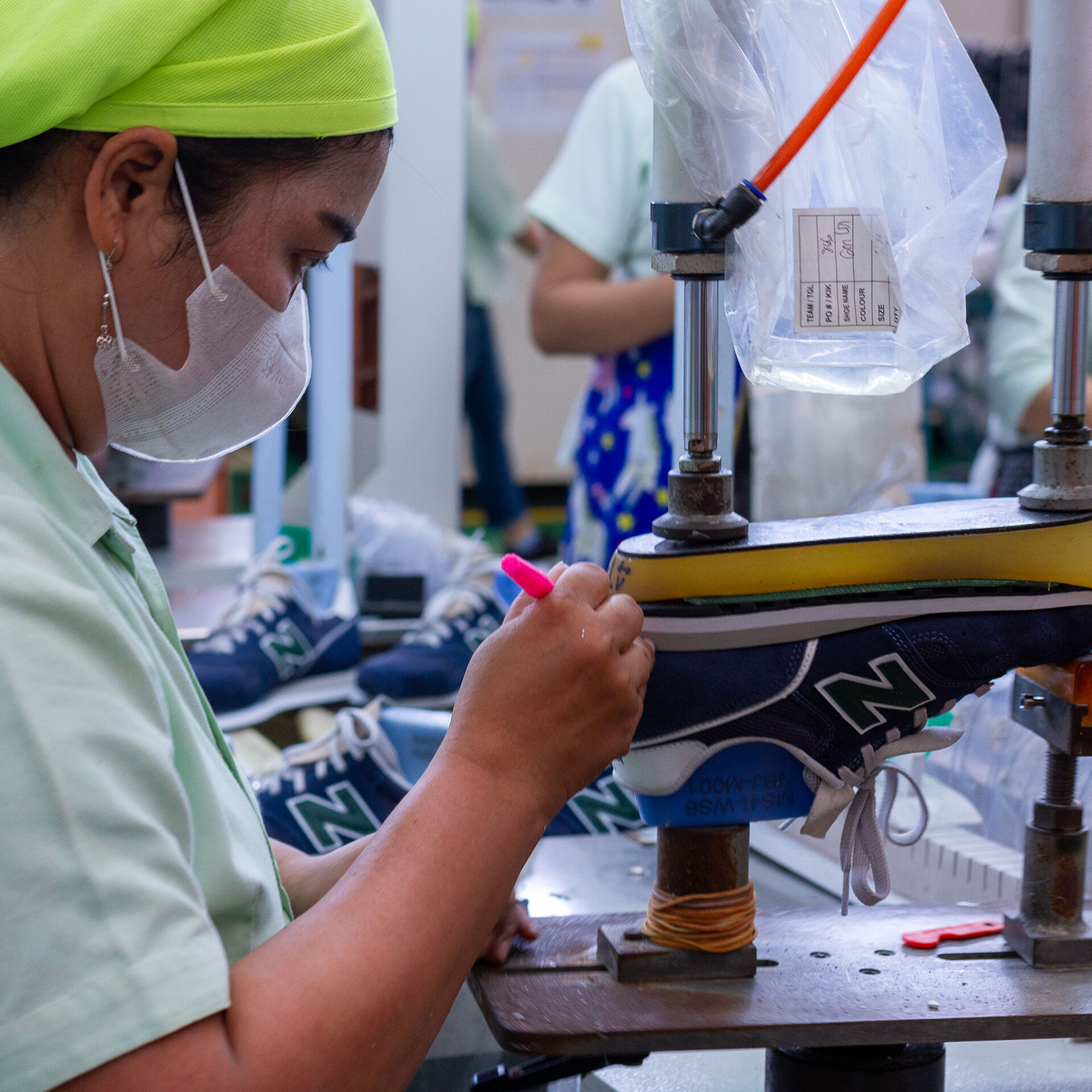 Female factory worker at work station